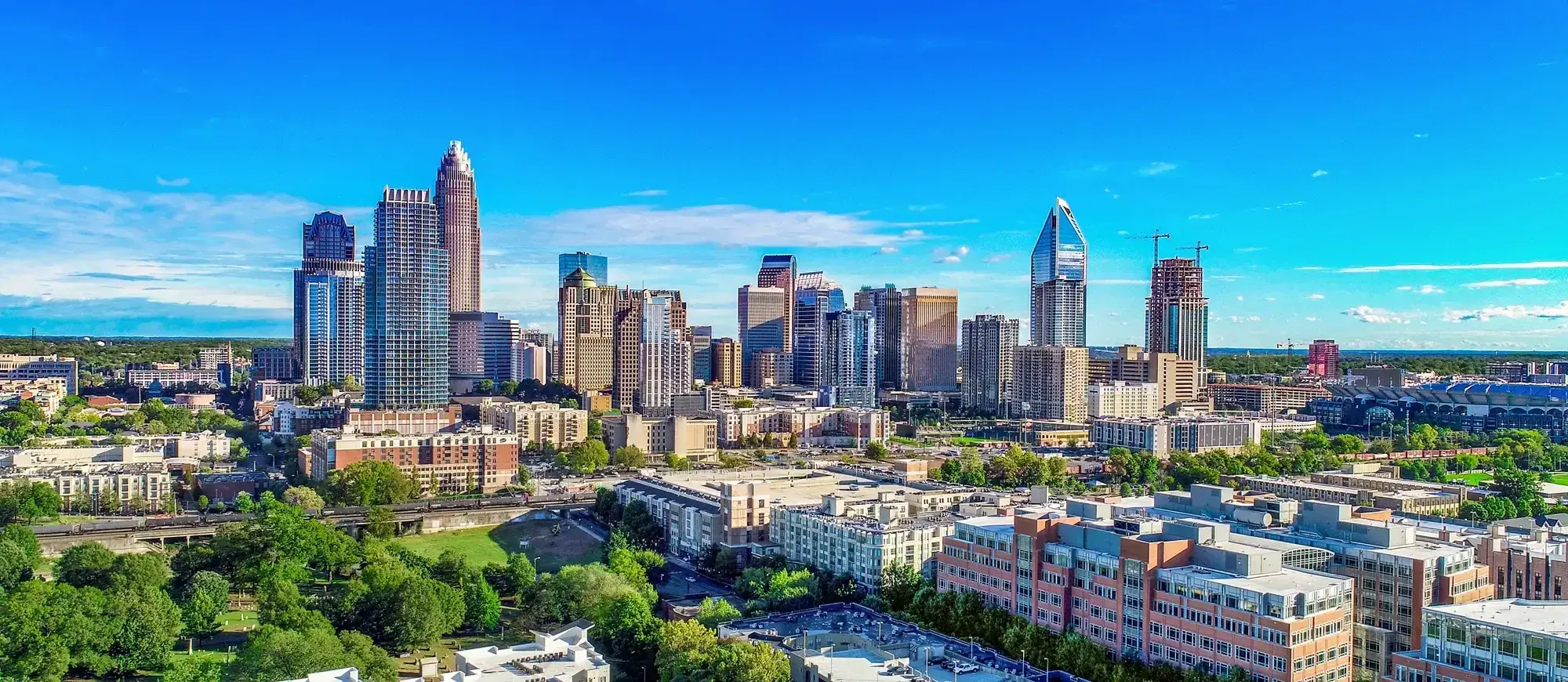 Charlotte Uptown skyline showcasing residential and commercial real estate growth