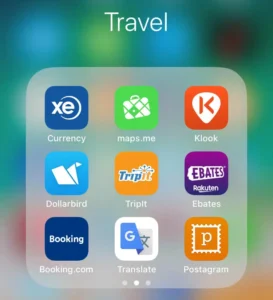Travel apps on smartphone for trip planning and navigation with VOY Black Car service