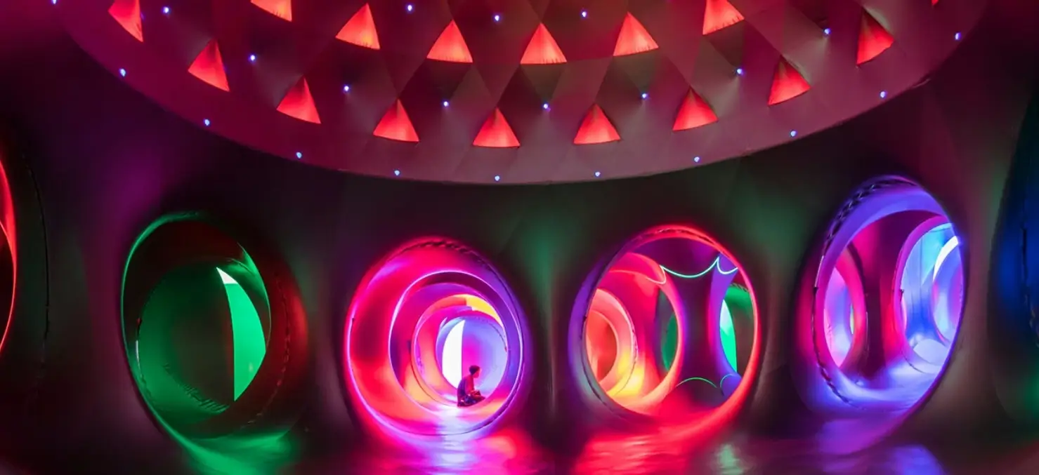 Colorful immersive light installations featured at Charlotte’s International Arts Festival, showcasing vibrant circular displays and interactive visual art