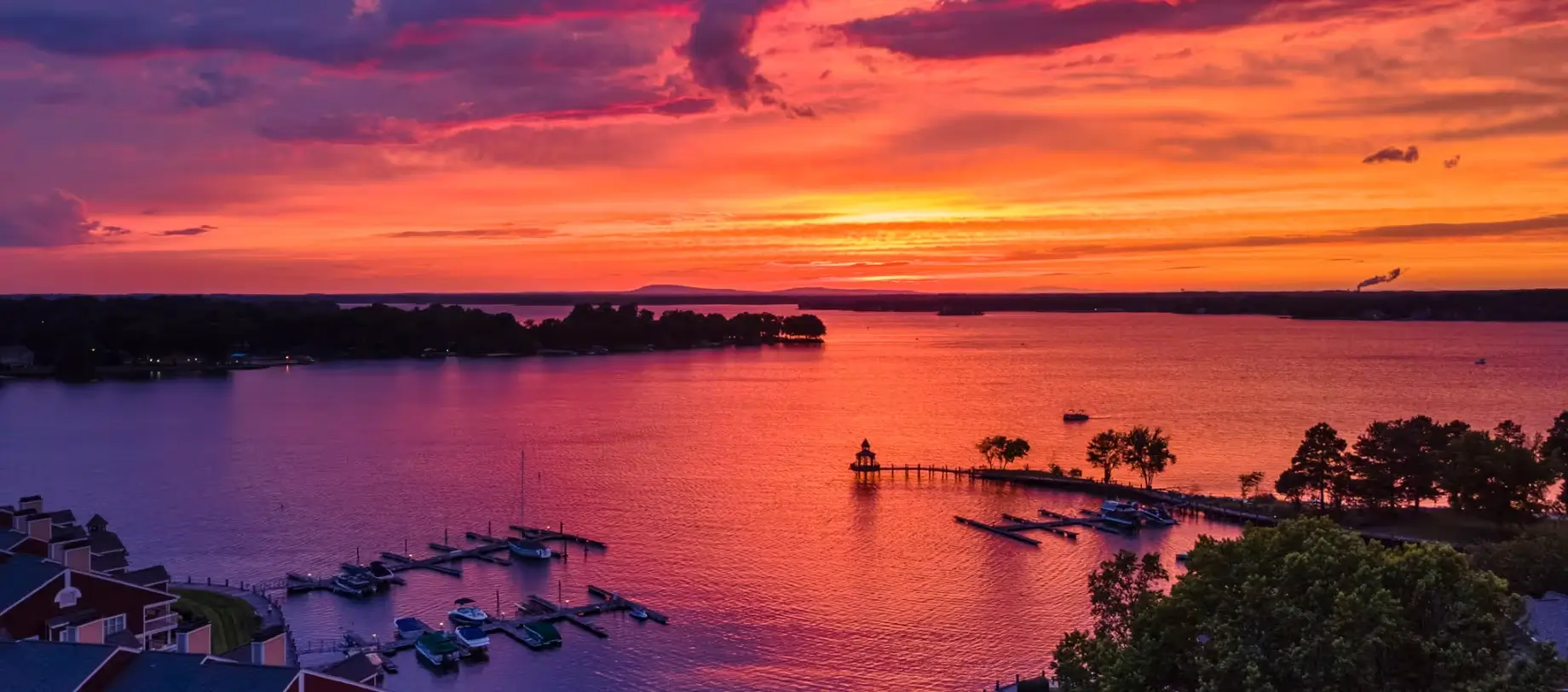 Lake Norman sunset waterfront view for leisure travel near Charlotte with VOY Black Car service