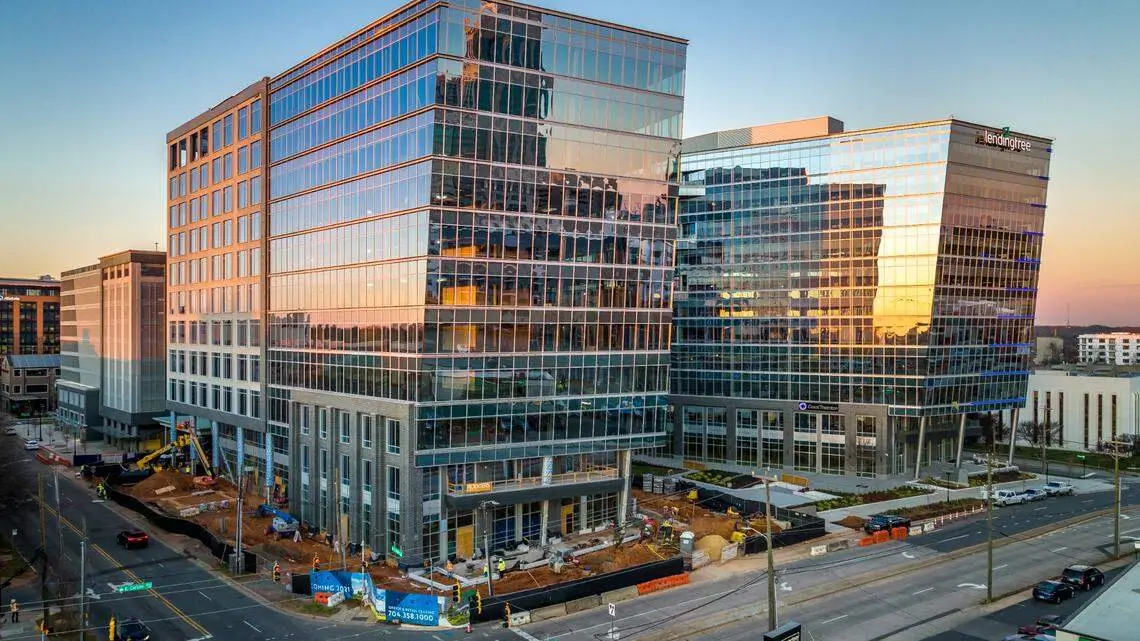 Modern glass office buildings in Charlotte’s South End, representing Brightspeed’s new headquarters and business expansion into the city