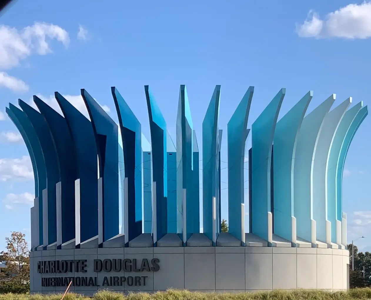 A modern blue sculptural installation outside Charlotte Douglas International Airport, representing one of the busiest airports and its top travel destinations