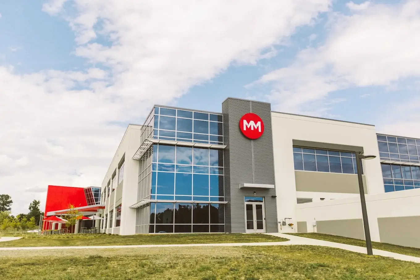 Movement Mortgage headquarters building with red logo and landscaped exterior in Charlotte