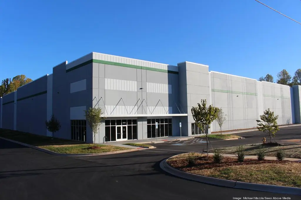 Newly constructed industrial facility near CLT Airport with parking area and front entrance