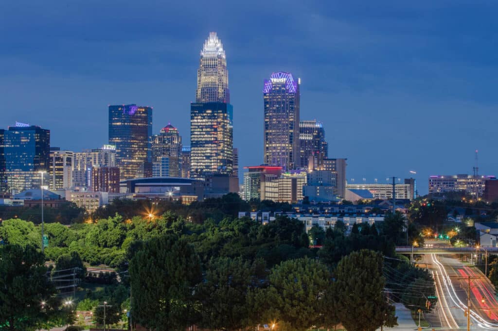 Charlotte skyline at night with illuminated skyscrapers and city lights