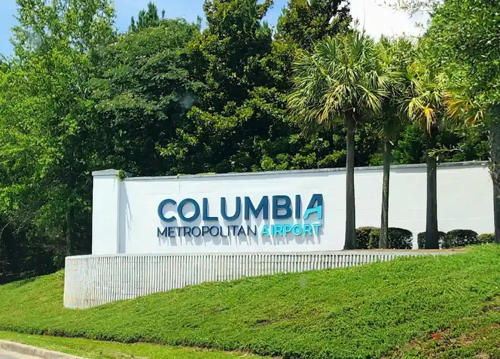 Columbia Metropolitan Airport CAE entrance sign with landscaped greenery in South Carolina