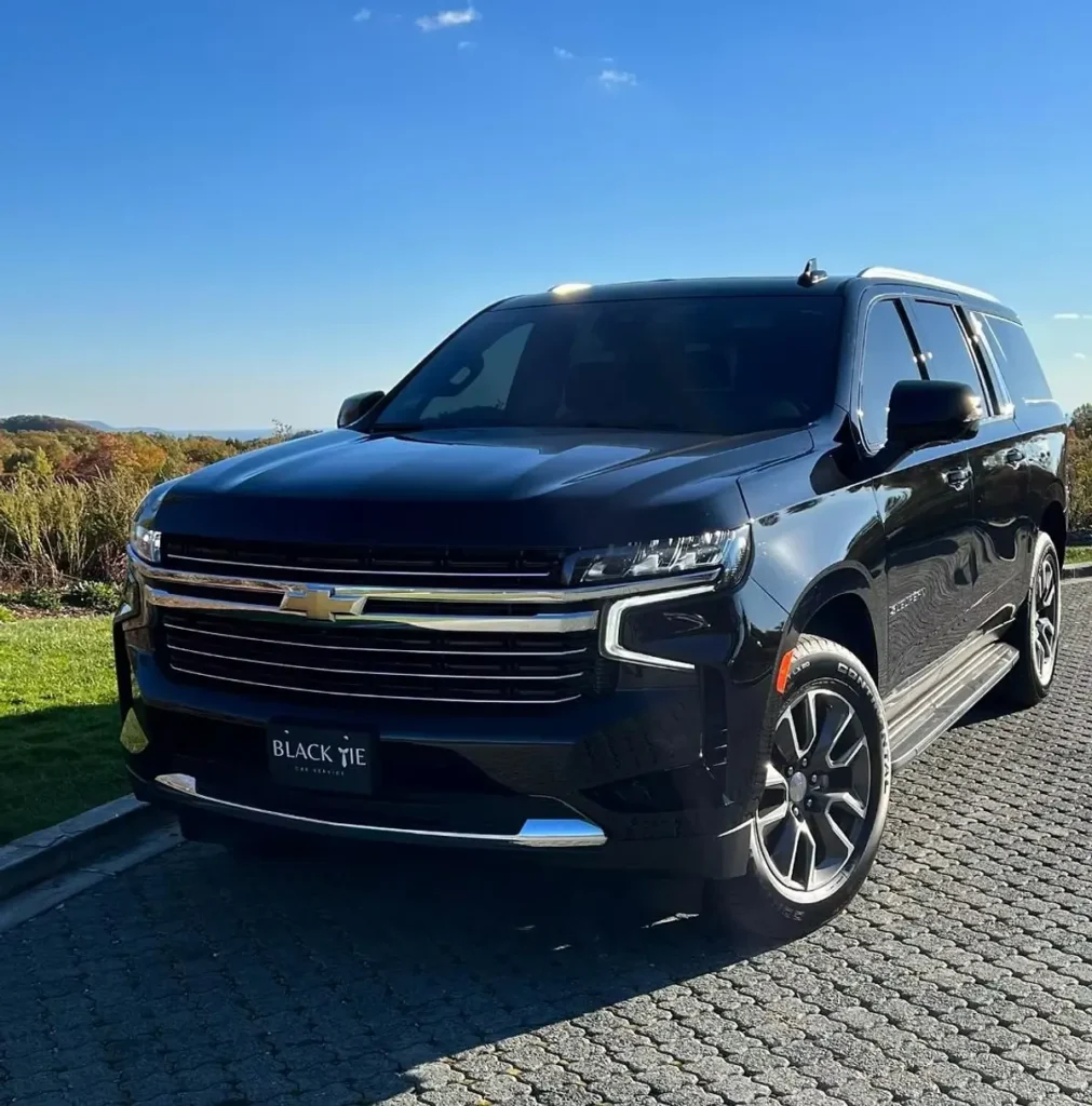Luxury black SUV executive car service vehicle parked outdoors
