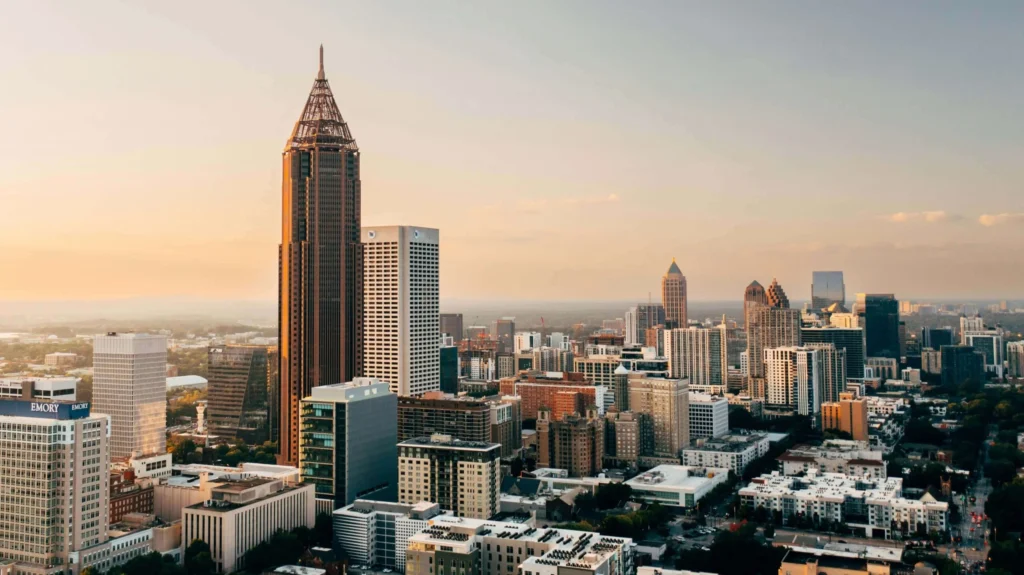 Atlanta skyline with tall buildings at sunset.