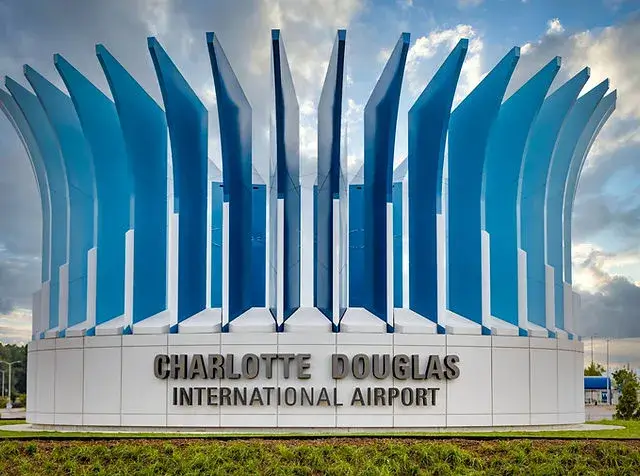 Charlotte Douglas International Airport entrance sign with modern blue architectural structure